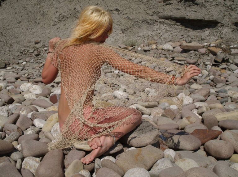 Blonde Beach Rock Beauty – A Celebration of Pure Naturism Photos